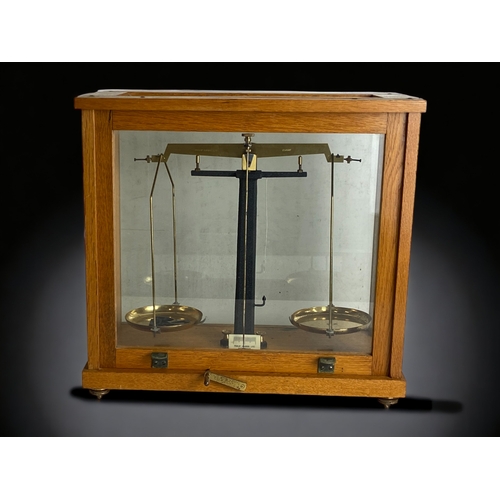 406 - SCIENTIFIC SCALES IN GLASS CASE.