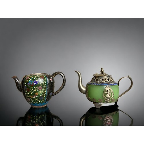 220B - A collection of Chinese teapots. Includes a Yixing relief moulded example, engraved Brass and Cast I... 