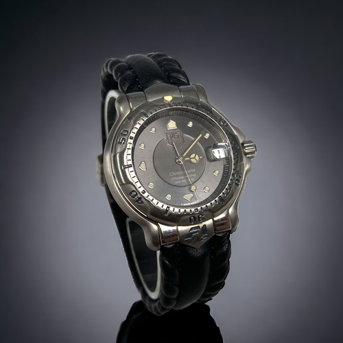 A RARE TAG HEUER 6000 McCLAREN F1 SPECIAL EDITION OWNERS WATCH. WITH ORIGINAL TYRE TREAD STRAP. WI