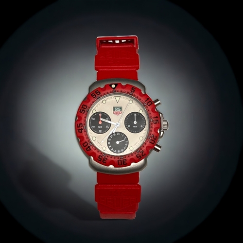 83 - AN ORIGINAL TAG HEUER McCLAREN FORMULA 1 MEN'S WRISTWATCH. RED / SILVER DIAL.

'FROM A COLLECTION OF... 