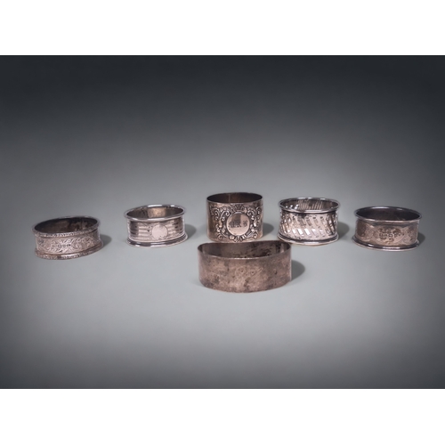 75 - A COLLECTION OF SIX ANTIQUE STERLING SILVER NAPKIN RINGS. INCLUDES LONDON & CHESTER HALLMARKS.
116.7... 