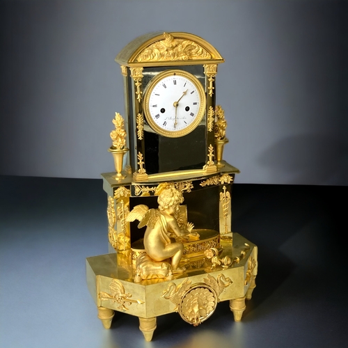 207 - A FRENCH EMPIRE ORMOLU MANTLE CLOCK.
CIRCA 1810.
WHITE ENAMEL DIAL, WITH BLACK ROMAN NUMERALS, SIGNE... 