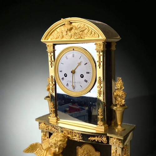 207 - A FRENCH EMPIRE ORMOLU MANTLE CLOCK.
CIRCA 1810.
WHITE ENAMEL DIAL, WITH BLACK ROMAN NUMERALS, SIGNE... 