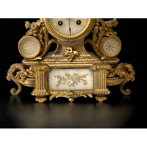 209 - A FRENCH GILT METAL AND ALABASTER MANTLE CLOCK.
CARVED & GILDED ALABASTER FACE WITH ROMAN NUMERALS.
... 