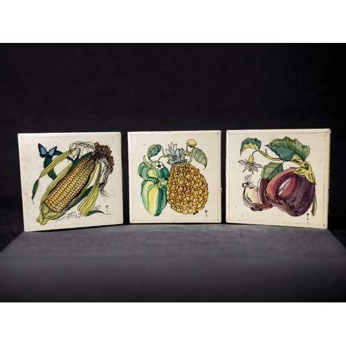 218 - A SET OF THREE HANDPAINTED 'FRUIT' TILES. 
ARTIST MONOGRAM MARK TO LOWER RIGHT.
6