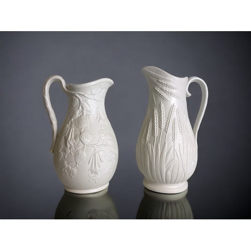 219 - TWO VICTORIAN RELIEF MOULDED DRABWARE PITCHERS. INCLUDING A DUDSON BARLEYCORN EXAMPLE.