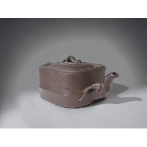 2 - A CHINESE YIXING CLAY TEAPOT. WITH RELIEF BAMBOO DESIGN.
12.5 X 5CM