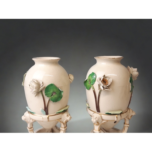 238 - A PAIR OF CHRISTOPHER DRESSER FOR MINTON 'CHINESE TRIPOD' VASES. 
RELIEF LILY DESIGN.
DATE CYPHERS F... 