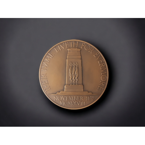 191 - A RARE 1928 ARMISTICE MEMORIAL DAY MEDAL. DESIGNED BY C.L DOMAN.
DEPICTING BRITANNIA SUPPORTING THE ... 