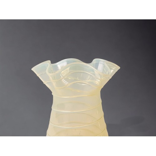 244 - A JAMES POWELL WHITEFRIARS RIBBED STRAW OPAL GLASS VASE. 
HEIGHT - 10.5CM