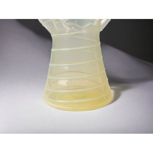 244 - A JAMES POWELL WHITEFRIARS RIBBED STRAW OPAL GLASS VASE. 
HEIGHT - 10.5CM