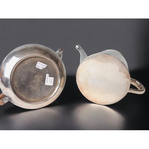 256 - TWO 19TH CENTURY SILVER PLATE TEAPOTS AND HOT WATER JUG.