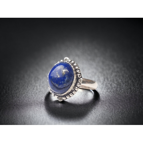 147 - A STERLING SILVER & LAPIS LAZULI SET LADIES RING.
SIZE - T