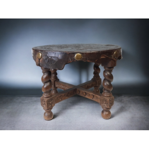 71 - EARLY 20TH CENTURY EMBOSSED LEATHER & OAK STOOL. 
28 X 38CM