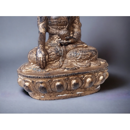 30 - A 19TH CENTURY TIBETAN GILT BRONZE SHAKYAMUNI BUDDHA. ROBES ADORNED WITH SCROLLING DRAGONS.
HEIGHT -... 