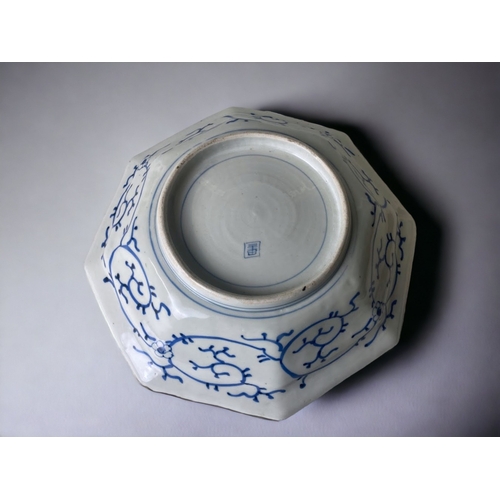 18 - A LARGE CHINESE PORCELAIN OCTAGONAL DISH. 
QING DYNASTY. 
PAINTED BLUE & WHITE SYMBOLS WITH MEANDER ... 