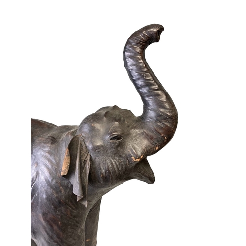 74 - A LARGE VINTAGE LIBERTY OF LONDON? LEATHER MOUNTED MODEL OF AN ELEPHANT.
HEIGHT - 78CM