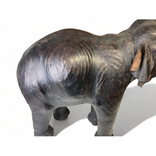 74 - A LARGE VINTAGE LIBERTY OF LONDON? LEATHER MOUNTED MODEL OF AN ELEPHANT.
HEIGHT - 78CM