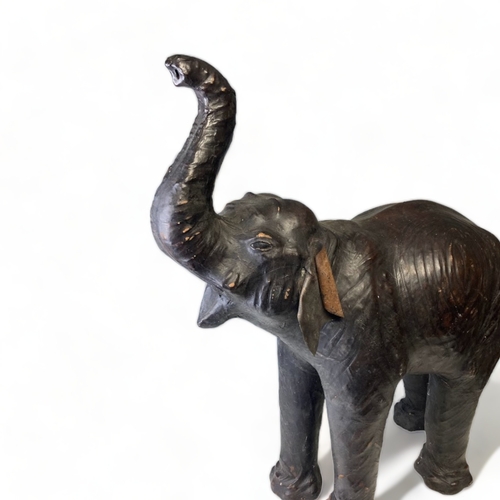 74 - A LARGE VINTAGE LIBERTY OF LONDON? LEATHER MOUNTED MODEL OF AN ELEPHANT.
HEIGHT - 78CM