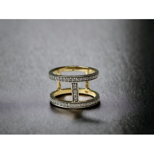 125 - Two modernist CZ gold on 925 silver rings size P 1/2 and R 1/2.