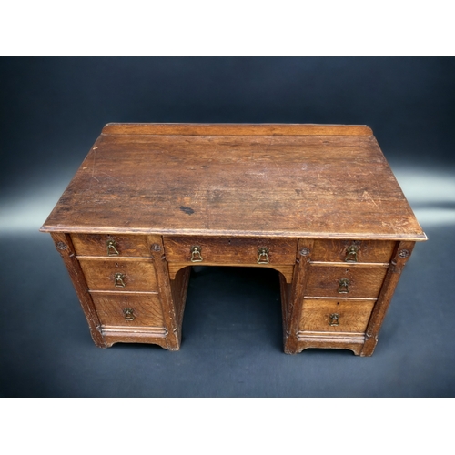 102 - AN EARLY VICTORIAN GILLOWS OF LANCASTER & LONDON OAK WRITING TWIN-PEDESTAL DESK.