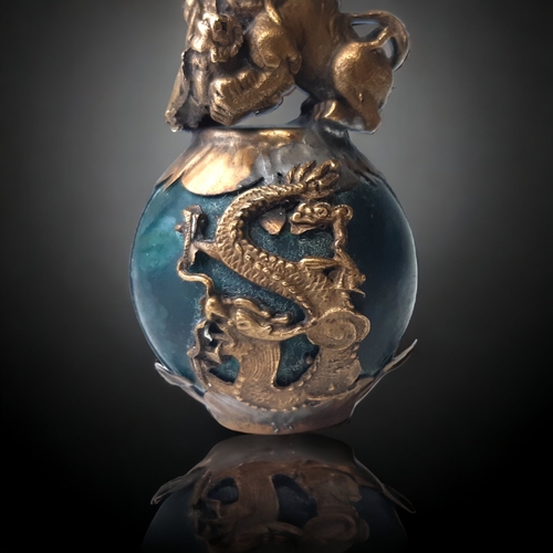 55 - A CHINESE TIBETAN GILT METAL & JADE FO DOG.
GILT METAL LION & CUB ATOP A GLOBULAR JADE BALL SURMOUNT... 