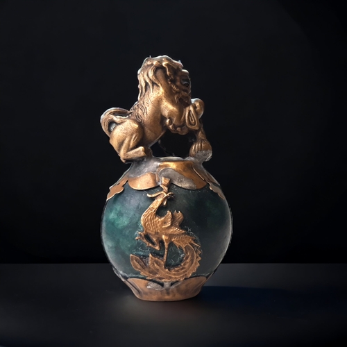 55 - A CHINESE TIBETAN GILT METAL & JADE FO DOG.
GILT METAL LION & CUB ATOP A GLOBULAR JADE BALL SURMOUNT... 