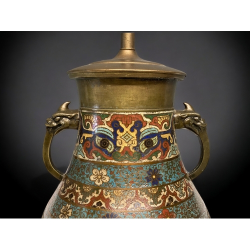 59 - A LARGE CHINESE CLOISONNE LAMP. QING DYNASTY. DEPICTING CARTOUCHES WITH TWIN PHOENIX ABOVE LOTUS AND... 