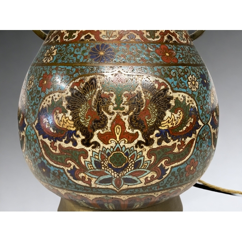 59 - A LARGE CHINESE CLOISONNE LAMP. QING DYNASTY. DEPICTING CARTOUCHES WITH TWIN PHOENIX ABOVE LOTUS AND... 