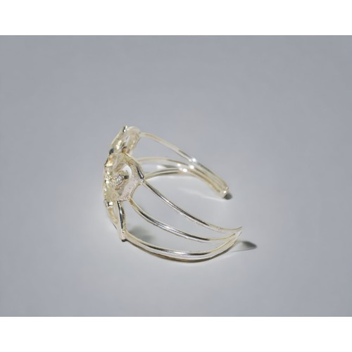 196 - A ladies sterling silver Butterfly bangle.