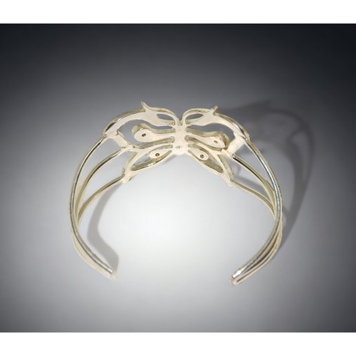 196 - A ladies sterling silver Butterfly bangle.