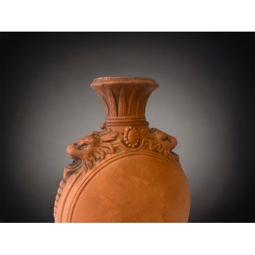 266 - A 19TH CENTURY WATCOMBE POTTERY MOON FLASK VASE. RELIEF MOUNTED WITH STYLISED ZOOMORPHIC MASKS TO SH... 