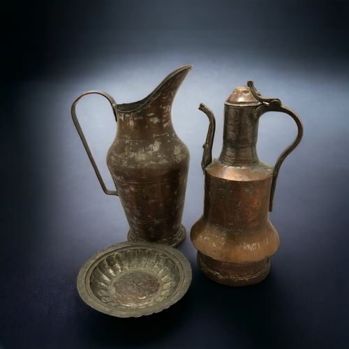 291 - A PERSIAN COPPER AFTABA WATER JUG, TOGETHER WITH A DALLAH COFFEE POT AND OTHER