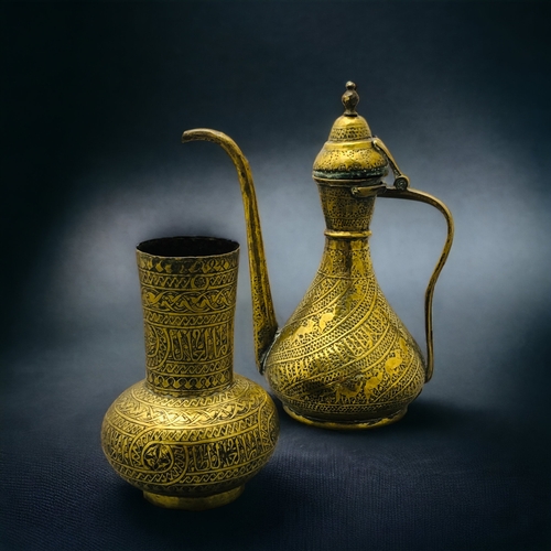 294 - A PERSIAN BRASS DALLAH COFFEE POT TOGETHER WITH A SIMILAR VASE.