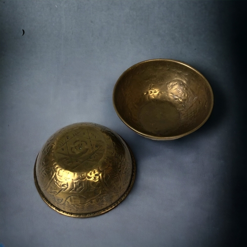 299 - TWO ANTIQUE PERSIAN ENGRAVED BRASS BOWLS.