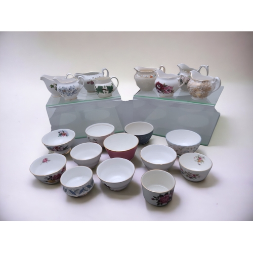 338 - A LARGE COLLECTION OF VINTAGE CHINA MILK JUGS & SUGAR BOWLS.