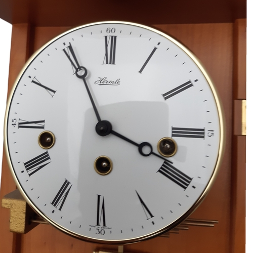 348 - A VINTAGE HERMLE WALL CLOCK. WITH KEY.