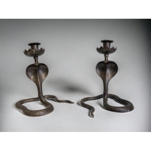 304 - A PAIR OF VINTAGE INDIAN BLACK BRASS COBRA CANDLESTICKS. 
HEIGHT - 22CM