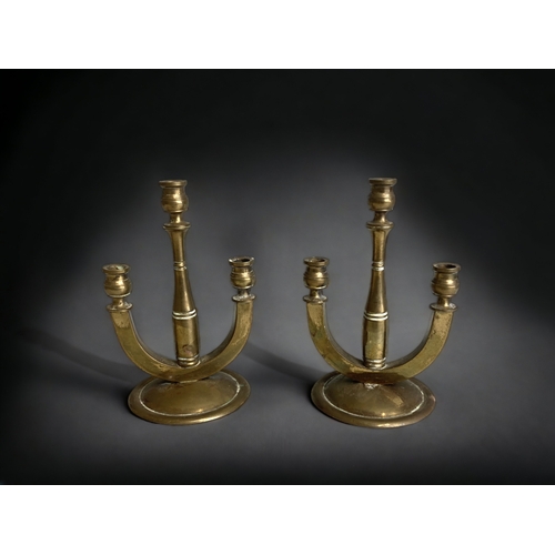 157 - A VINTAGE BRASS MENORAH CANDELABRA, TOGETHER WITH A PAIR OF SMALLER THREE BRANCH CANDLESTICKS. 
HEIG... 