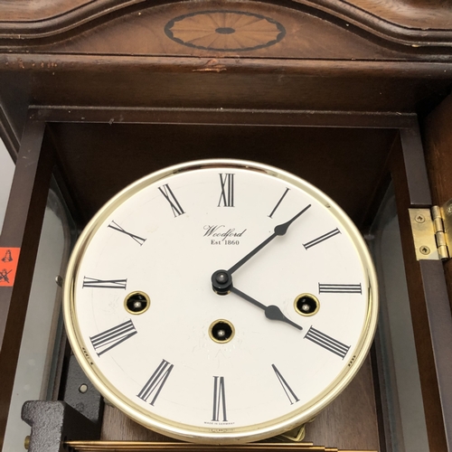 376 - A WOODFORD VIENNA WALL CLOCK. STRIKING ON FIVE BAR GONG.