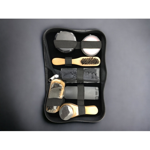 386 - A LARGE LOT OF SHOE POLISHING KITS