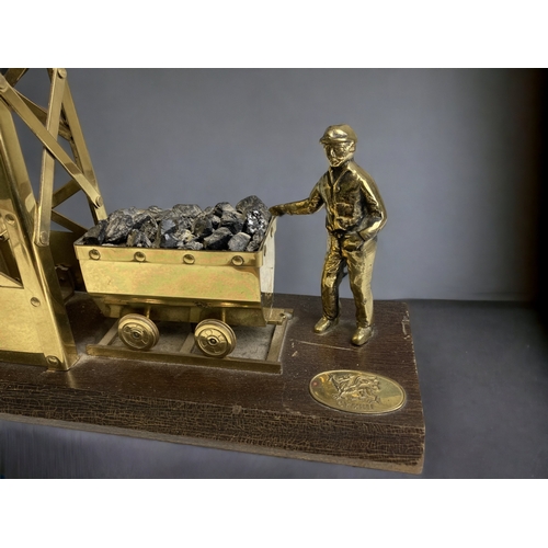 158 - A WELSH BRASS & WOODEN COAL MINING PIT HEAD MODEL.
33 X 27CM