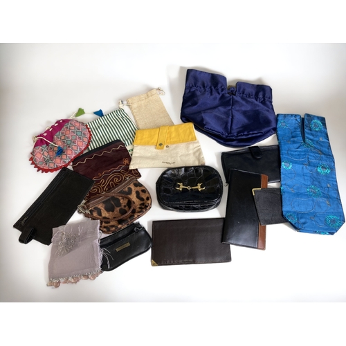 395 - A LARGE COLLECTION OF LADIES PURSES & WALLETS.