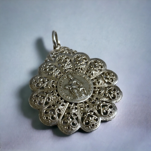 185 - A VINTAGE FRENCH SILVER FILIGREE PENDANT. 'NOTRE DAME DE THIERENBACH'