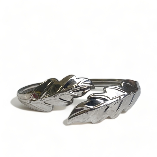 188 - A STERLING SILVER 'LEAF' BANGLE. TGCC BRAND, BRITISH HALLMARKS. IN A PANDORA BOX.