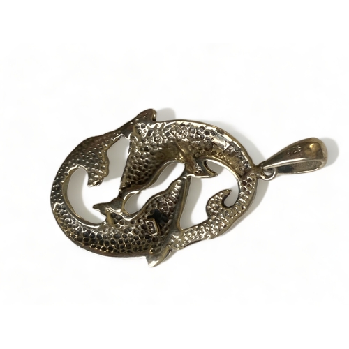 196 - A STERLING SILVER TWIN DOLPHIN PENDANT.