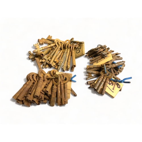 397 - LARGE BUNCHES OF ANTIQUE KEYS.