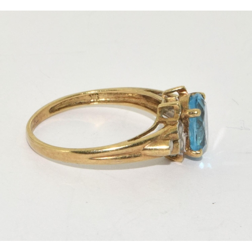 224 - 9ct gold ladies Diamond and Blue topaz ring size R