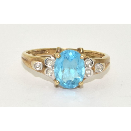 224 - 9ct gold ladies Diamond and Blue topaz ring size R