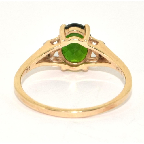 225 - 9ct gold ladies Diamond and Emerald colour centre stone ring size  S